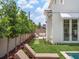 Serene backyard with lounge seating area accessible from the home's French doors at 541 W Canton Ave, Winter Park, FL 32789