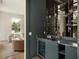 Stylish bar area with marble countertop, display shelving, and a beverage cooler at 541 W Canton Ave, Winter Park, FL 32789