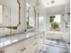 Luxurious bathroom featuring double vanities, a freestanding tub, and walk-in shower at 541 W Canton Ave, Winter Park, FL 32789
