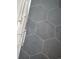 Modern bathroom features gray hexagon tile and sleek fixtures at 541 W Canton Ave, Winter Park, FL 32789