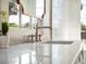 Close-up of a bathroom vanity with marble countertop, and elegant faucet at 541 W Canton Ave, Winter Park, FL 32789