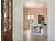 Bright dining room featuring a chandelier, light pink walls, and glass doors leading to the patio at 541 W Canton Ave, Winter Park, FL 32789