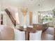 Open-concept living featuring a modern kitchen, a breakfast table, and staircase at 541 W Canton Ave, Winter Park, FL 32789