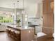 Bright, updated kitchen with a large island, pendant lights and a professional range at 541 W Canton Ave, Winter Park, FL 32789
