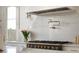 A close up of the kitchen range with custom backsplash and faucet at 541 W Canton Ave, Winter Park, FL 32789