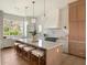 This open kitchen offers a large center island, stainless appliances, and seating for four at 541 W Canton Ave, Winter Park, FL 32789