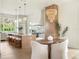 Dining area and open kitchen with an island, modern appliances, and stylish pendant lights at 541 W Canton Ave, Winter Park, FL 32789