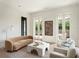 Chic living room with modern sofa, French doors, and a stylish coffee table at 541 W Canton Ave, Winter Park, FL 32789