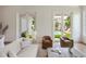 Inviting living room with neutral tones and French doors overlooking a pool at 541 W Canton Ave, Winter Park, FL 32789