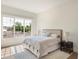 Serene main bedroom with large window, neutral palette, and stylish furnishings at 541 W Canton Ave, Winter Park, FL 32789