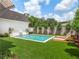 Inviting backyard pool features a fountain, lounge chairs, and pristine artificial turf at 541 W Canton Ave, Winter Park, FL 32789