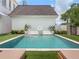 Beautiful backyard pool features a tiled border and a charming fountain feature at 541 W Canton Ave, Winter Park, FL 32789