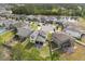 Aerial view showcasing the home's backyard, patio, and the surrounding community with a pond at 5458 Carrara Ct, St Cloud, FL 34771