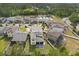 Aerial view of the home showcasing its backyard, the surrounding neighborhood and nearby pond at 5458 Carrara Ct, St Cloud, FL 34771
