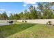 Large backyard with a lush lawn and a white privacy fence, ideal for outdoor activities and relaxation at 5458 Carrara Ct, St Cloud, FL 34771