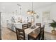 Open-concept dining room with views into the kitchen and living areas, ideal for entertaining at 5458 Carrara Ct, St Cloud, FL 34771