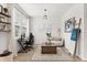 Bright office space with a large window, modern desk, and neutral decor at 5458 Carrara Ct, St Cloud, FL 34771
