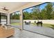 Relaxing patio setup with comfortable seating and outdoor dining area, perfect for entertaining in the backyard at 5458 Carrara Ct, St Cloud, FL 34771