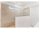 Modern tiled shower with glass enclosure and a small awning window for natural light at 5458 Carrara Ct, St Cloud, FL 34771