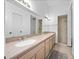 Bathroom with dual sinks, spacious countertops, and a walk-in shower at 6042 Brookhill Cir, Orlando, FL 32810
