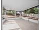 Covered, screened lanai offering views of a large backyard with a shed and wooden fence at 6042 Brookhill Cir, Orlando, FL 32810