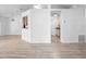 Open-concept living area with tile and wood-look floors, connecting kitchen at 6042 Brookhill Cir, Orlando, FL 32810