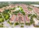 Overhead of a condo complex with view of a community pool, pond, and well-manicured lawns at 625 Pavia Loop, Lake Mary, FL 32746
