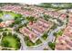 Aerial shot showcasing the community with its terracotta roofs, lush greenery, and well-kept landscaping at 625 Pavia Loop, Lake Mary, FL 32746