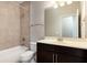 Bathroom featuring tub and shower combination with vanity sink and overhead lighting at 625 Pavia Loop, Lake Mary, FL 32746