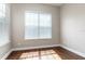 An empty bedroom with natural light streaming through the white blind-covered windows at 625 Pavia Loop, Lake Mary, FL 32746