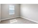 Well-lit bedroom with plush carpeting and one window adorned with horizontal blinds at 625 Pavia Loop, Lake Mary, FL 32746