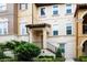 Inviting townhome showcases a well-manicured lawn and a charming facade, creating a warm and welcoming curb appeal at 625 Pavia Loop, Lake Mary, FL 32746