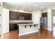 Gourmet kitchen featuring granite countertops, stainless steel appliances, and custom cabinets, perfect for cooking at 625 Pavia Loop, Lake Mary, FL 32746