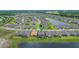Aerial view of a community with houses, lakes, and green spaces at 636 San Augusto Dr, Kissimmee, FL 34759