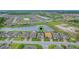 Community aerial showcasing neighborhood layout, lush greenery, and scenic lakes at 636 San Augusto Dr, Kissimmee, FL 34759