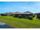 Expansive backyard featuring a screened-in patio with comfortable seating at 636 San Augusto Dr, Kissimmee, FL 34759