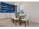 Elegant dining room with modern table set and built-in storage with decorative display shelves at 636 San Augusto Dr, Kissimmee, FL 34759