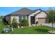 Inviting exterior of home with manicured landscaping and a well-maintained lawn at 636 San Augusto Dr, Kissimmee, FL 34759