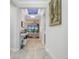 Bright hallway with elegant tile flooring and a view of the spacious living area at 636 San Augusto Dr, Kissimmee, FL 34759