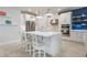 Modern kitchen featuring white cabinets, stainless appliances, and a large center island at 636 San Augusto Dr, Kissimmee, FL 34759
