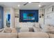 Comfortable living room with a modern TV, built-in shelving, and stylish decor at 636 San Augusto Dr, Kissimmee, FL 34759