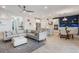 Open-concept living space with a large sofa, modern kitchen, and stylish dining area at 636 San Augusto Dr, Kissimmee, FL 34759