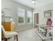 Bright office with a modern desk, wood filing cabinet, and plantation shutters on the windows at 636 San Augusto Dr, Kissimmee, FL 34759