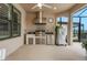 Outdoor kitchen with stainless steel appliances, sink, grill and a view of the outdoors at 636 San Augusto Dr, Kissimmee, FL 34759