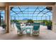 Covered patio featuring outdoor furniture and scenic views of the pool and landscaping at 636 San Augusto Dr, Kissimmee, FL 34759