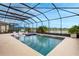 Private screened pool area with relaxing outdoor seating and lake views at 636 San Augusto Dr, Kissimmee, FL 34759