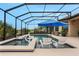 Beautifully designed pool with a hot tub and ample outdoor seating within a screened enclosure at 636 San Augusto Dr, Kissimmee, FL 34759
