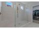 Modern bathroom featuring a spacious glass shower with dual showerheads and a built-in seat at 636 San Augusto Dr, Kissimmee, FL 34759