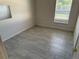 Simple bedroom with neutral walls and floors, offering a blank canvas for personalization and comfort at 6625 Cherry Grove Cir, Orlando, FL 32809