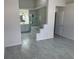 View of the main bedroom leading to the main bathroom with a tub and shower at 6625 Cherry Grove Cir, Orlando, FL 32809